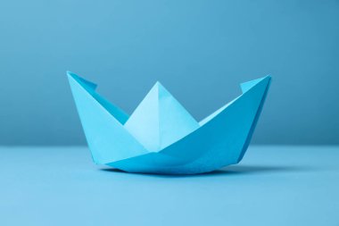 Concept of travel and adventure with paper boat