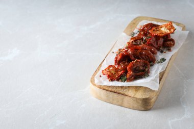 Concept of tasty food - sun-dried tomato, space for text