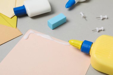 Concept of different office stationery with glue