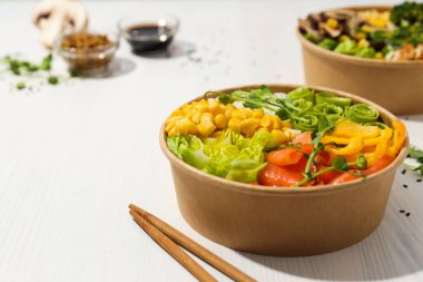 Bowls with tasty and nutritious food, space for text clipart