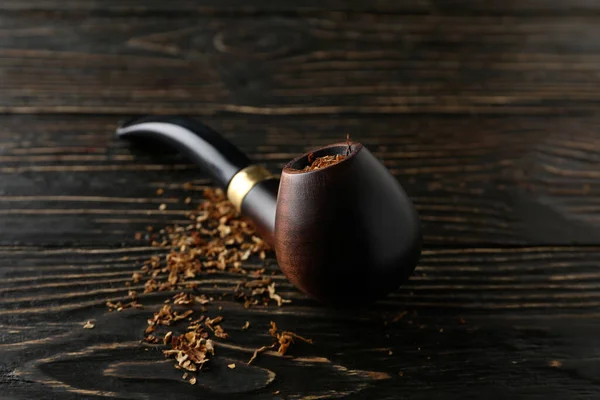 Concept of relaxing, smoking pipe, close up