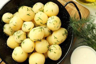 Concept of tasty food with boiled young potatoes, close up