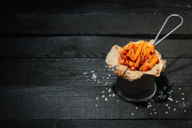 Concept of tasty food, fried sweet potato, space for text