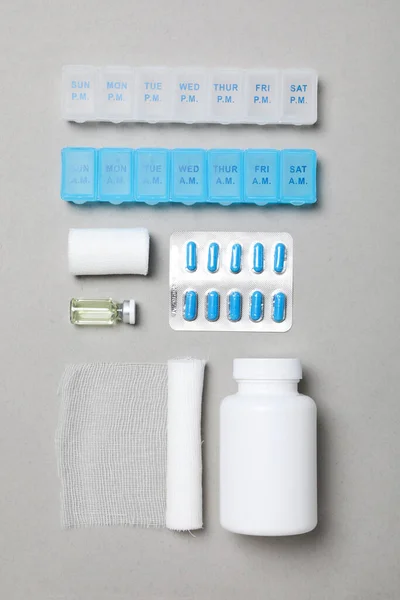 First aid kit supplies on gray background