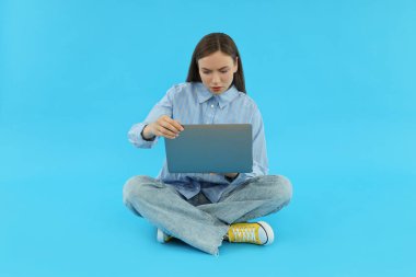 Concept of people, young woman on blue background