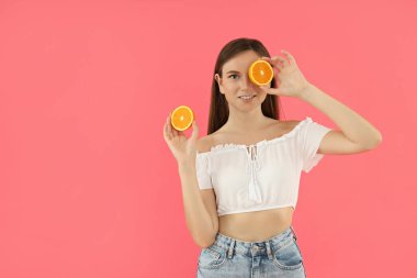Concept of people, young woman on pink background