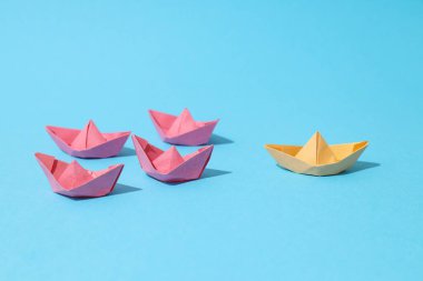 Concept of leadership and business with paper boats