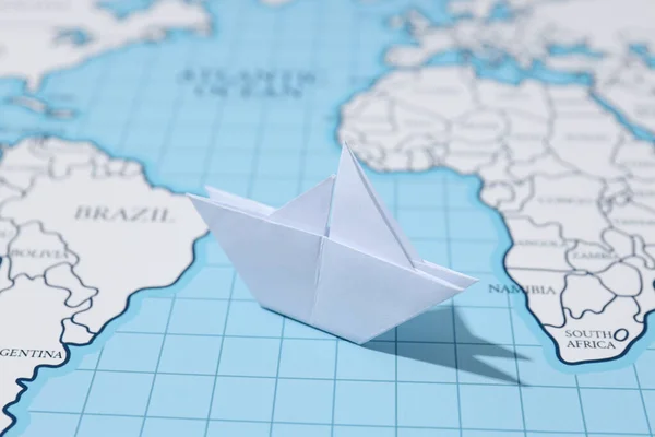 Concept of travel and adventure with paper boat