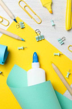 Concept of different office stationery with glue