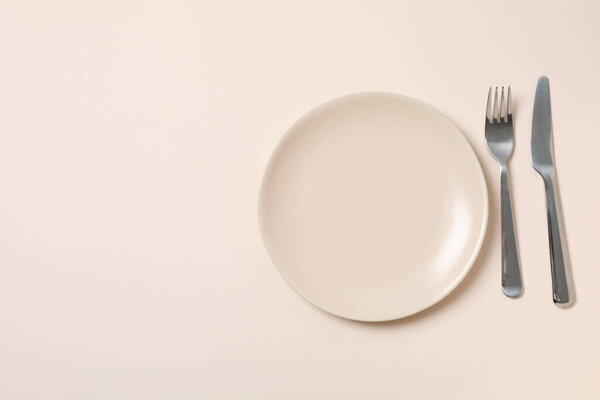 Minimal table setting with blank dish, space for text