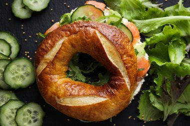 Concept of delicious food - tasty bagel sandwich