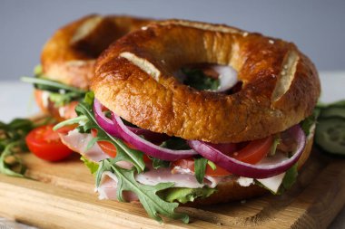 Concept of delicious food - tasty bagel sandwich