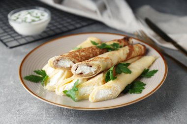 Concept of tasty food, thin pancakes with filling