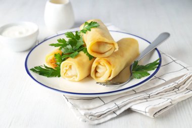 Concept of tasty food, thin pancakes with filling