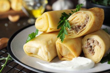 Concept of tasty food, thin pancakes with filling