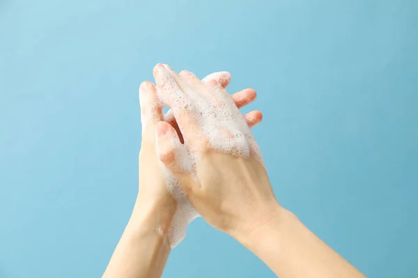 Hands with foam, spa, beauty procedures and skin care concept