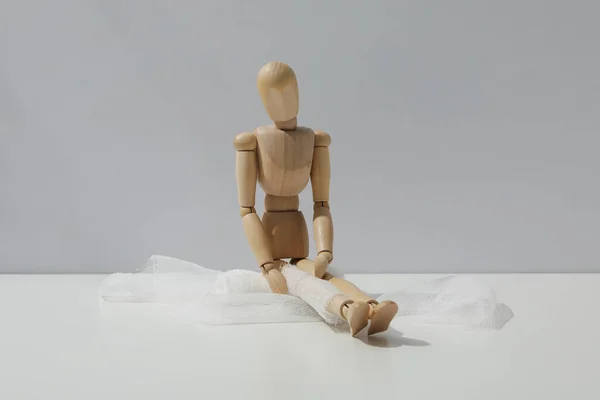 Concept Injury Wooden Puppet Bandage — Stock Photo, Image