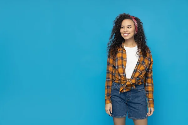 Young woman in casual wearing on blue background