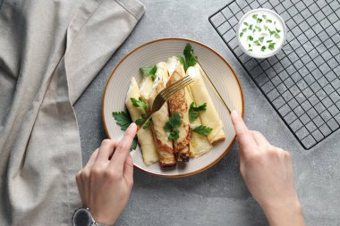 Concept of tasty food, thin pancakes with filling, top view