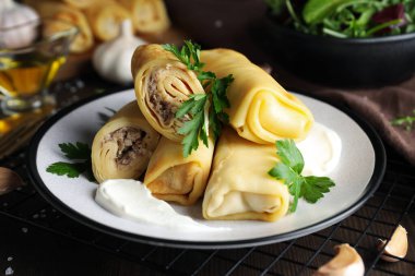 Concept of tasty food, thin pancakes with filling