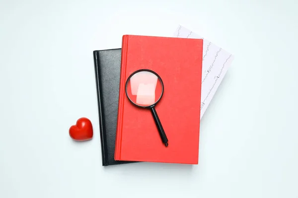 Medical literature - books and doctors accessories on white background