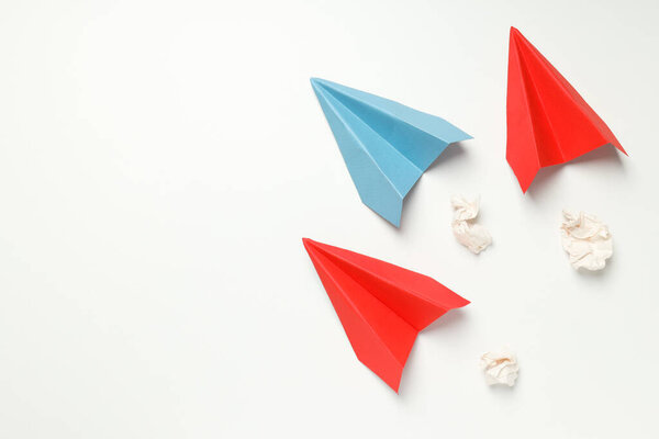 Business, startup and sponsorship concept with paper planes on white background