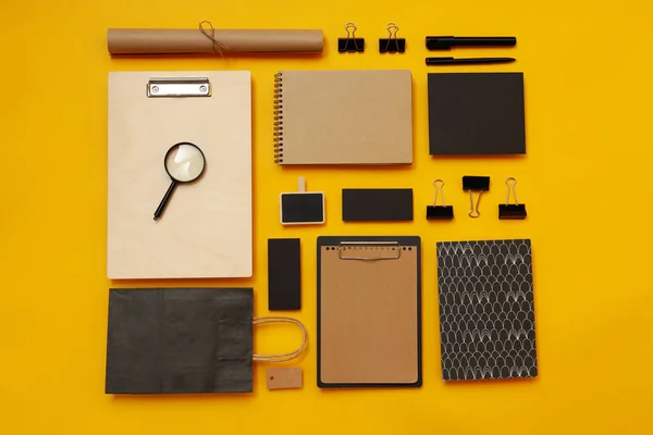 stock image Mockup flat lay with different office accessories on yellow background