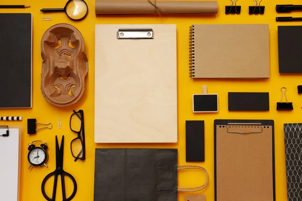 stock image Mockup flat lay with different office accessories on yellow background