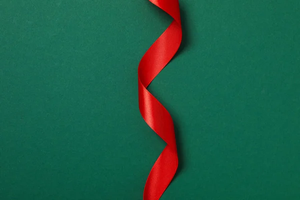 stock image Concept of different ribbons, red ribbon on green background