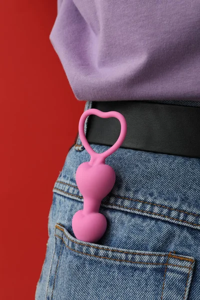 stock image Anal chain in the pocket of jeans on a red background