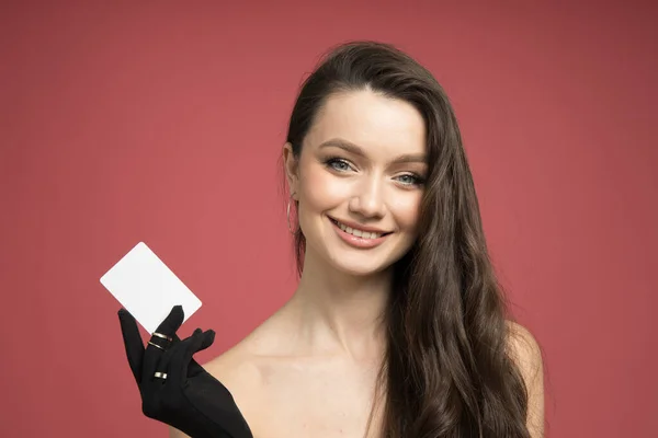 Pretty girl with a discount card in her hand
