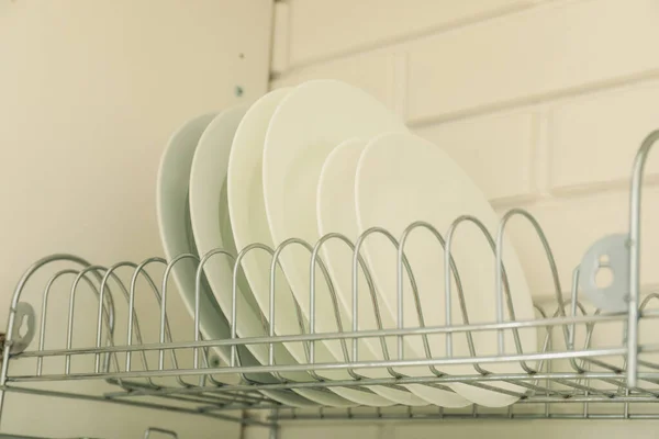 Stock image Plates on a stand for drying and storage