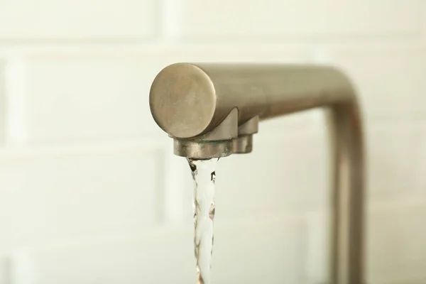 stock image Water is flowing from the faucet, close-up