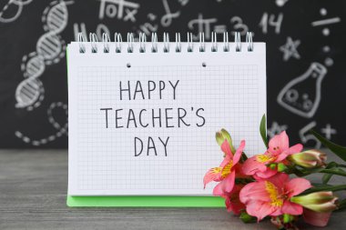 Öğretmenler Günü vesilesiyle bir not defterine yazılan tebrik yazısı.