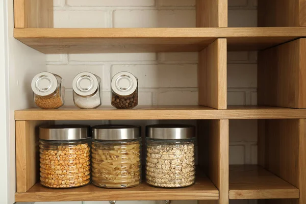 stock image Spices in the kitchen in jars, on open shelves