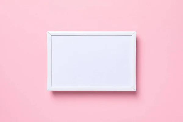 stock image White photo frame on a pink background