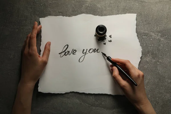 Tuscheflasche Stift Der Hand Und Worte Love You Auf Papier — Stockfoto