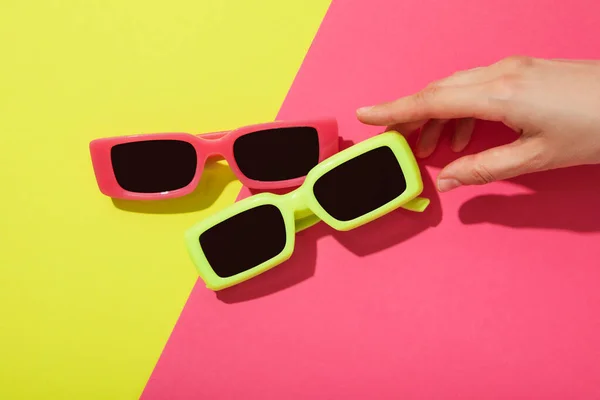 stock image A pair of sunglasses on a bright, colorful background