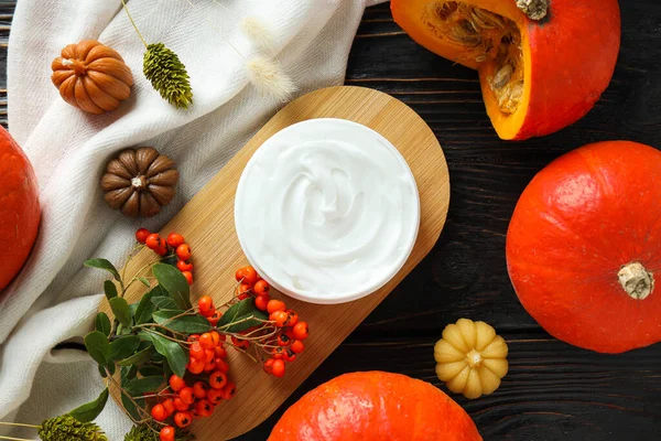 Skin care and face care concept - pumpkin cosmetic