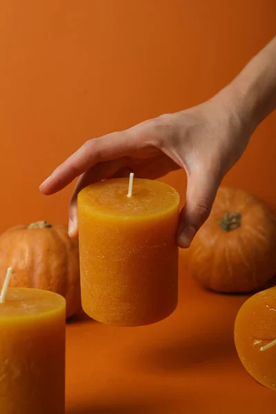 Candle Female Hand Pumpkins Orange Background — Stock Photo, Image