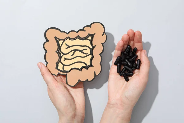 Mockup of a human stomach with activated charcoal tablets