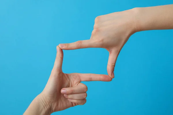 Female Hands Made Frame Fingers Blue Background — Stock Photo, Image