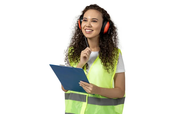 Stock image A girl in noise-absorbing headphones and a folder, isolated on white background