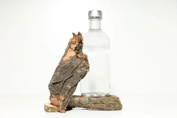 Glass Bottle Tree Bark White Background — Stock Photo, Image