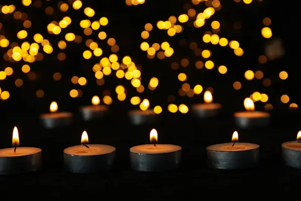 Small Burning Candles Table Black Background — Stock Photo, Image