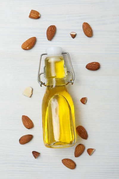 Skin care and body care concept - almonds, almond oil