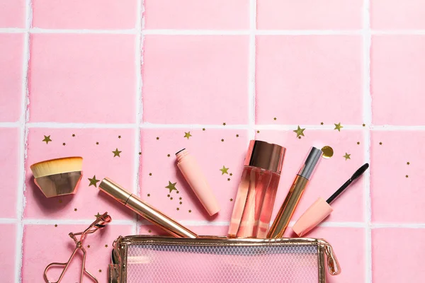 Women\'s makeup bag with pink makeup accessories