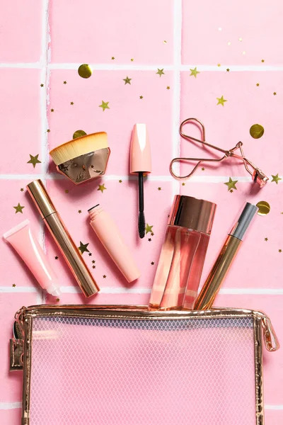 Women's makeup bag with pink makeup accessories