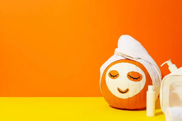 Pumpkin with face mask and skin care products