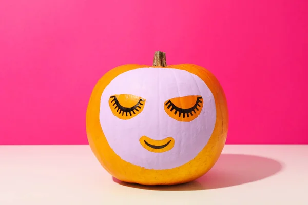 Skin and face care concept - pumpkin beauty mask